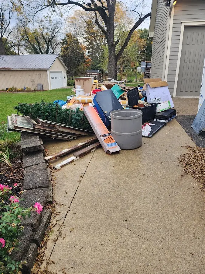 Dumpster being loaded with debris for 30 Yard Dumpster Rental in Smithfield